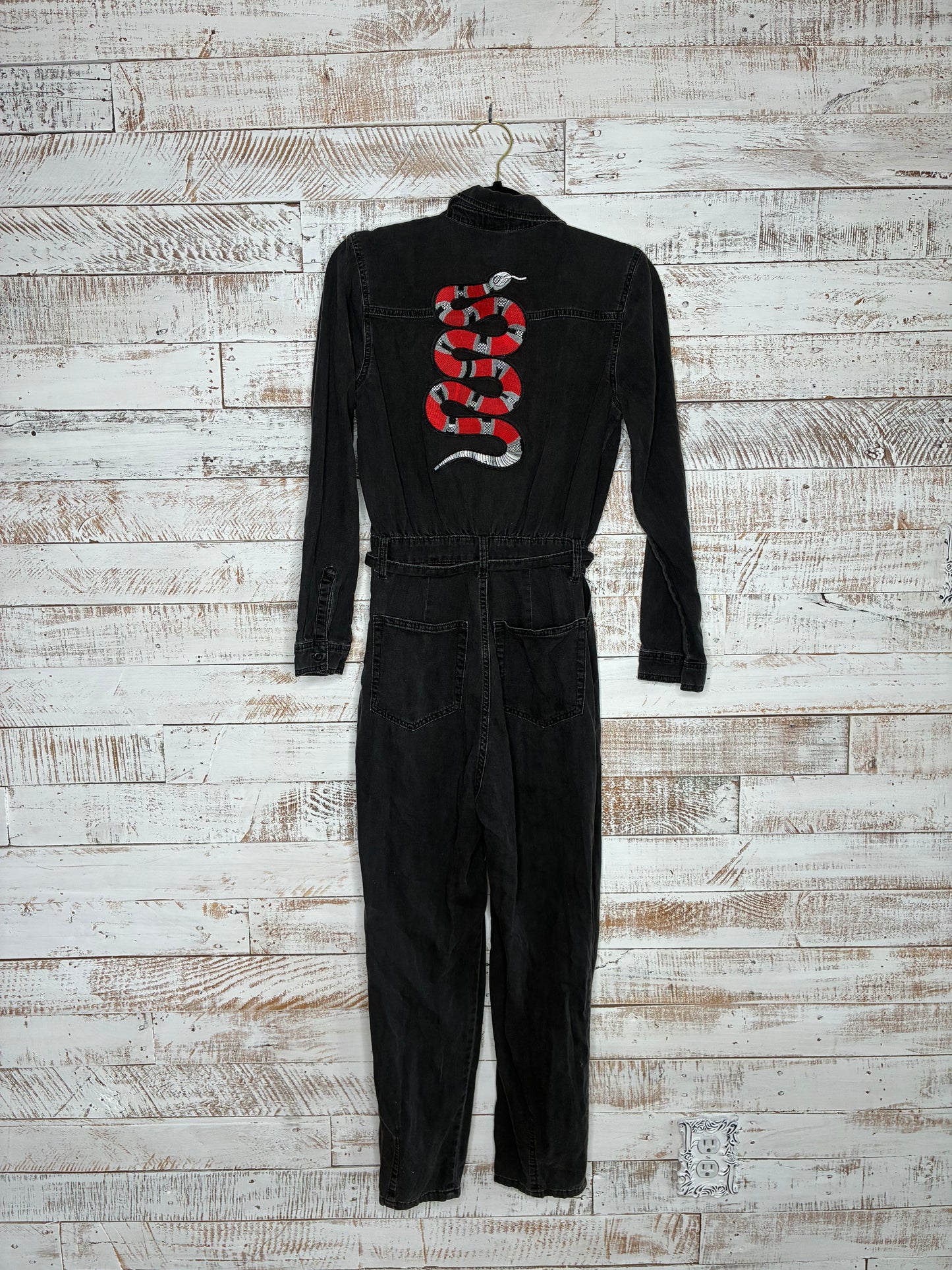 Long sleeve jumpsuit with red, black, and silver snake patch on back.&nbsp;